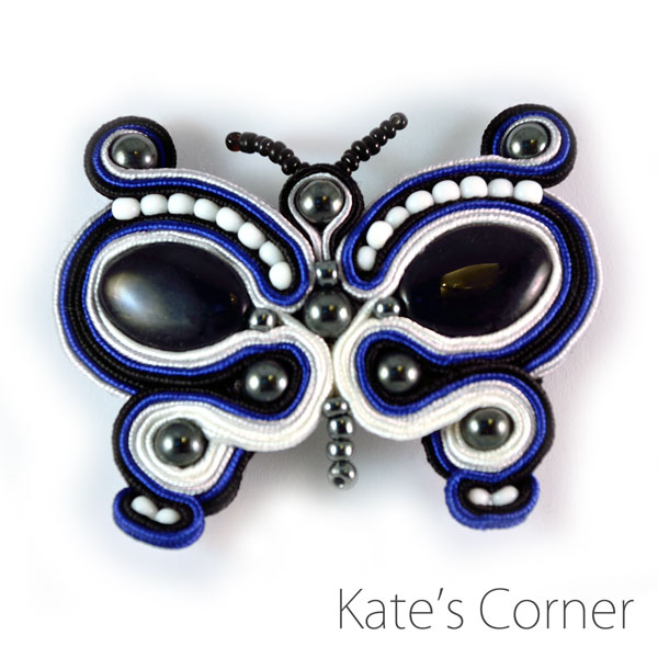 Black and white butterfly brooch