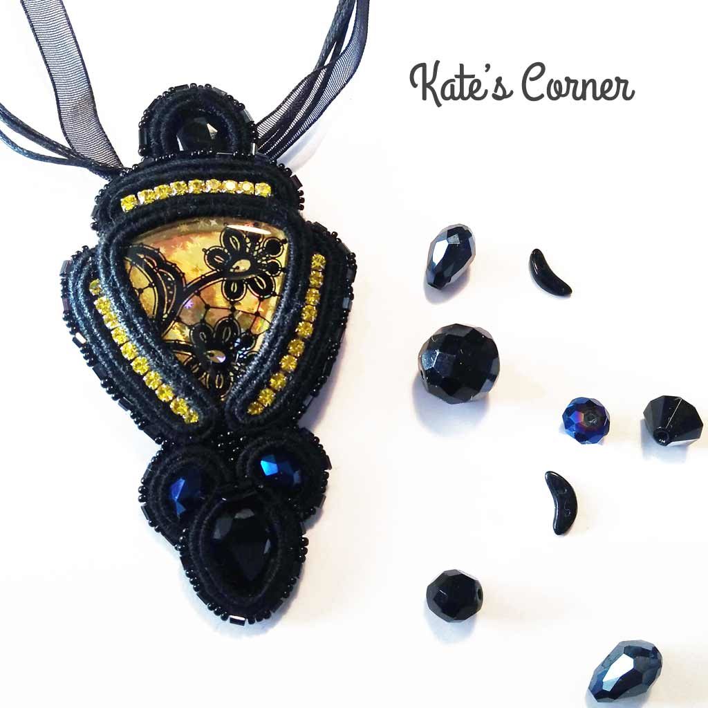 Black pendant with yellow cabochon